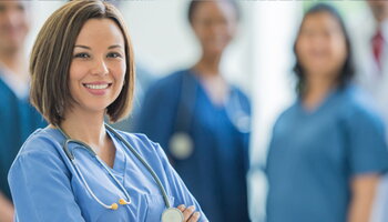 A woman wearing scrubs