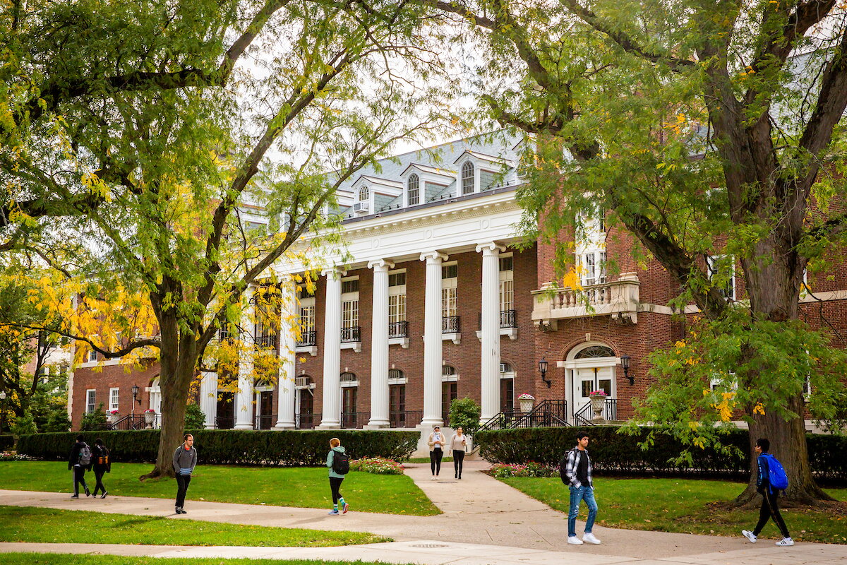students in front of the English building in the Fall