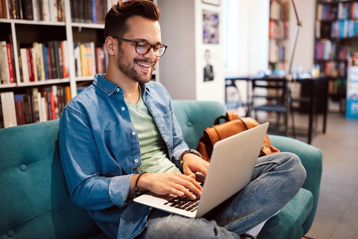 An adult student on a laptop
