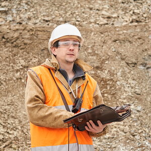 A worker holding a clipboard