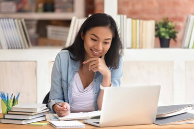 student studying on a laptop