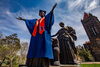 Alma mater in graduation gown